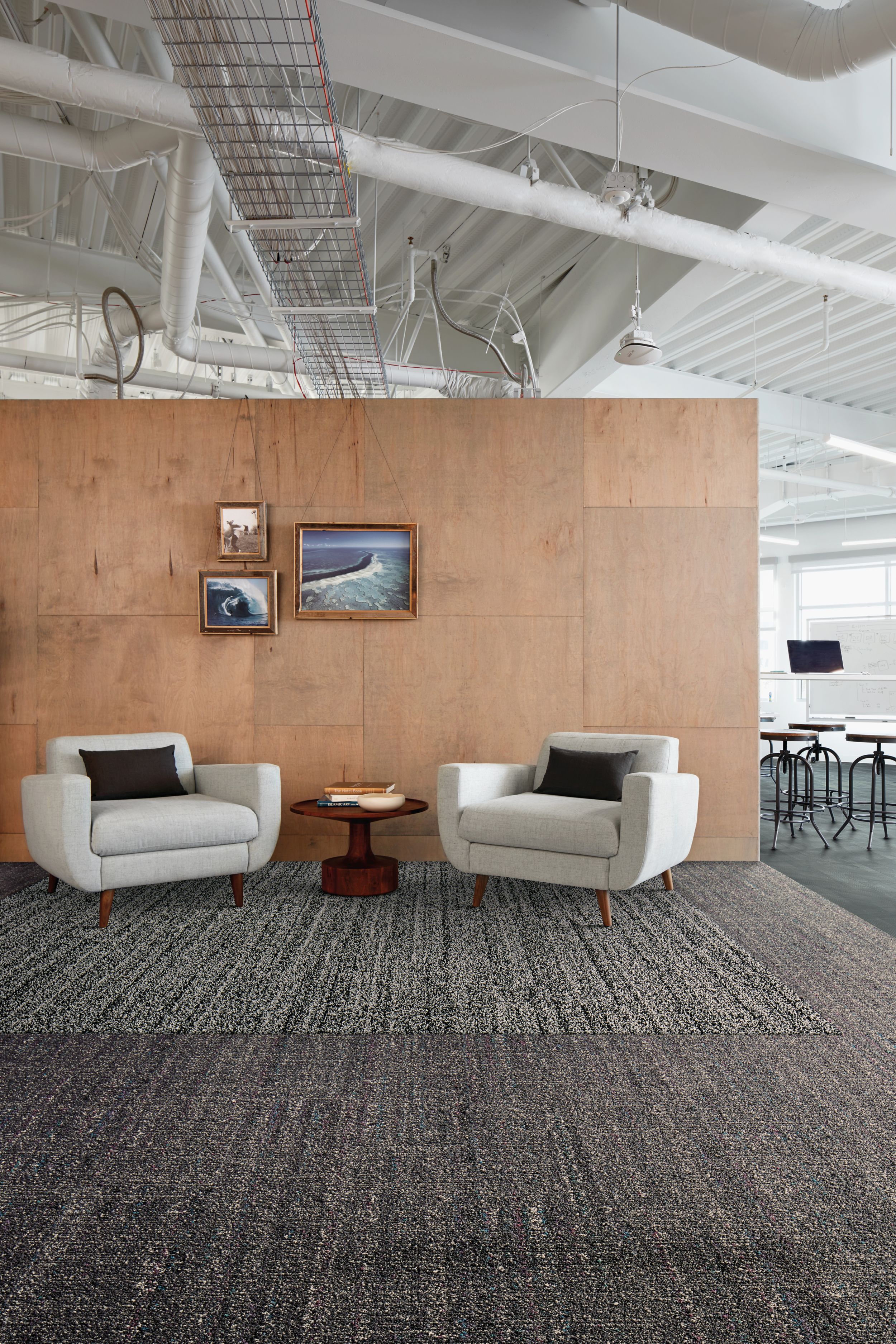 Interface Overedge and Static Lines plank carpet tile with Drawn Lines LVT with oversized fabric chairs and wood paneled wall imagen número 4